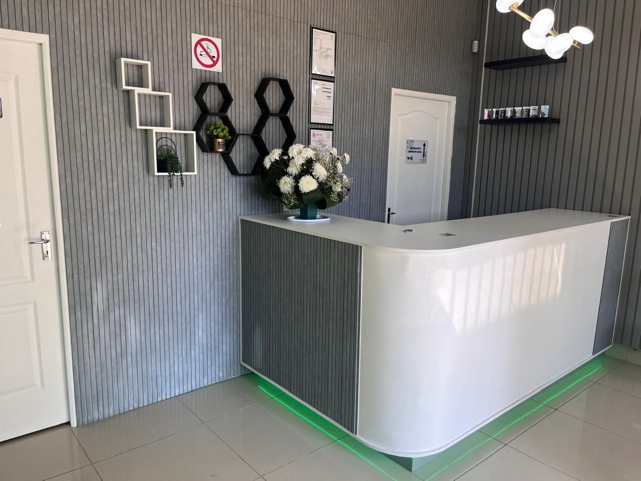 Niacanna private cannabis club reception desk with fresh flowers